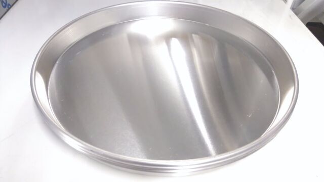 Set of 10 Aluminium Pizza Pans in 10x9" and 11" sizes, highlighting their non-stick surface ideal for deep pan pizza.