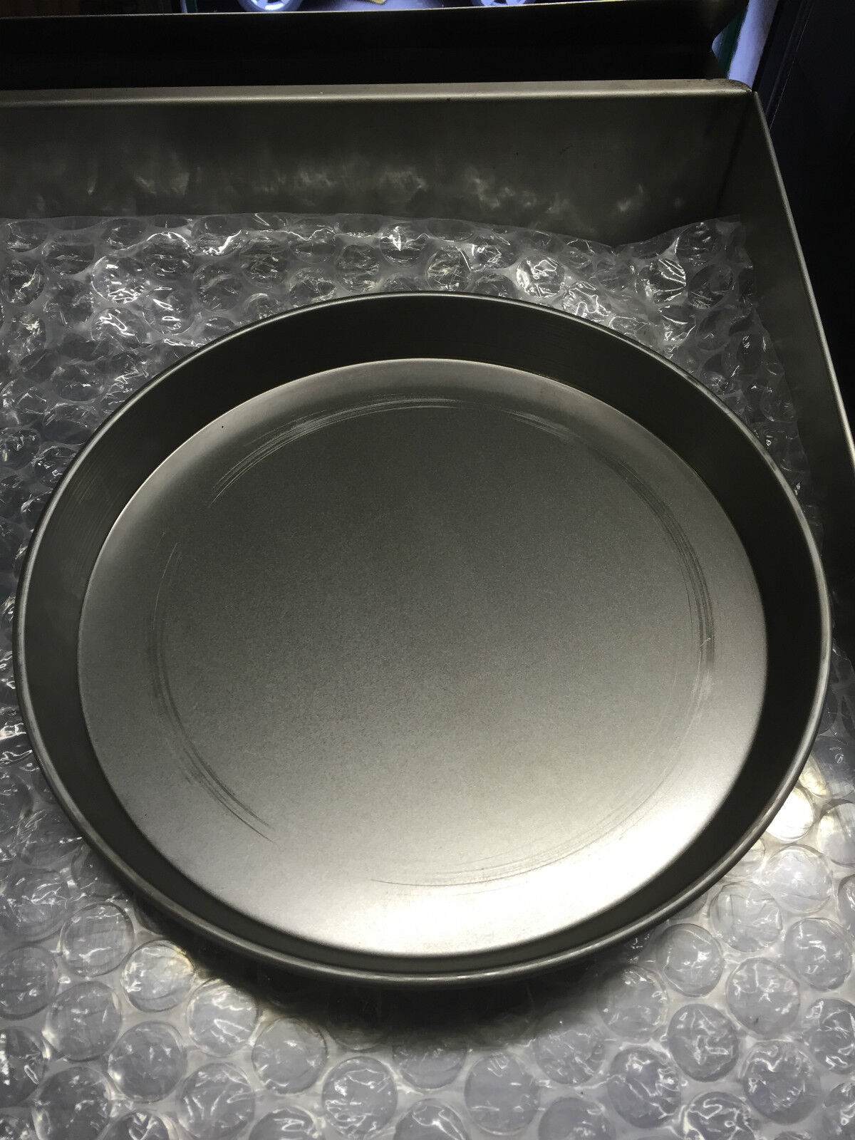 A selection of Iron Pizza Pans ranging from 7" to 16", featuring professional-quality construction for perfect pizzas every time.