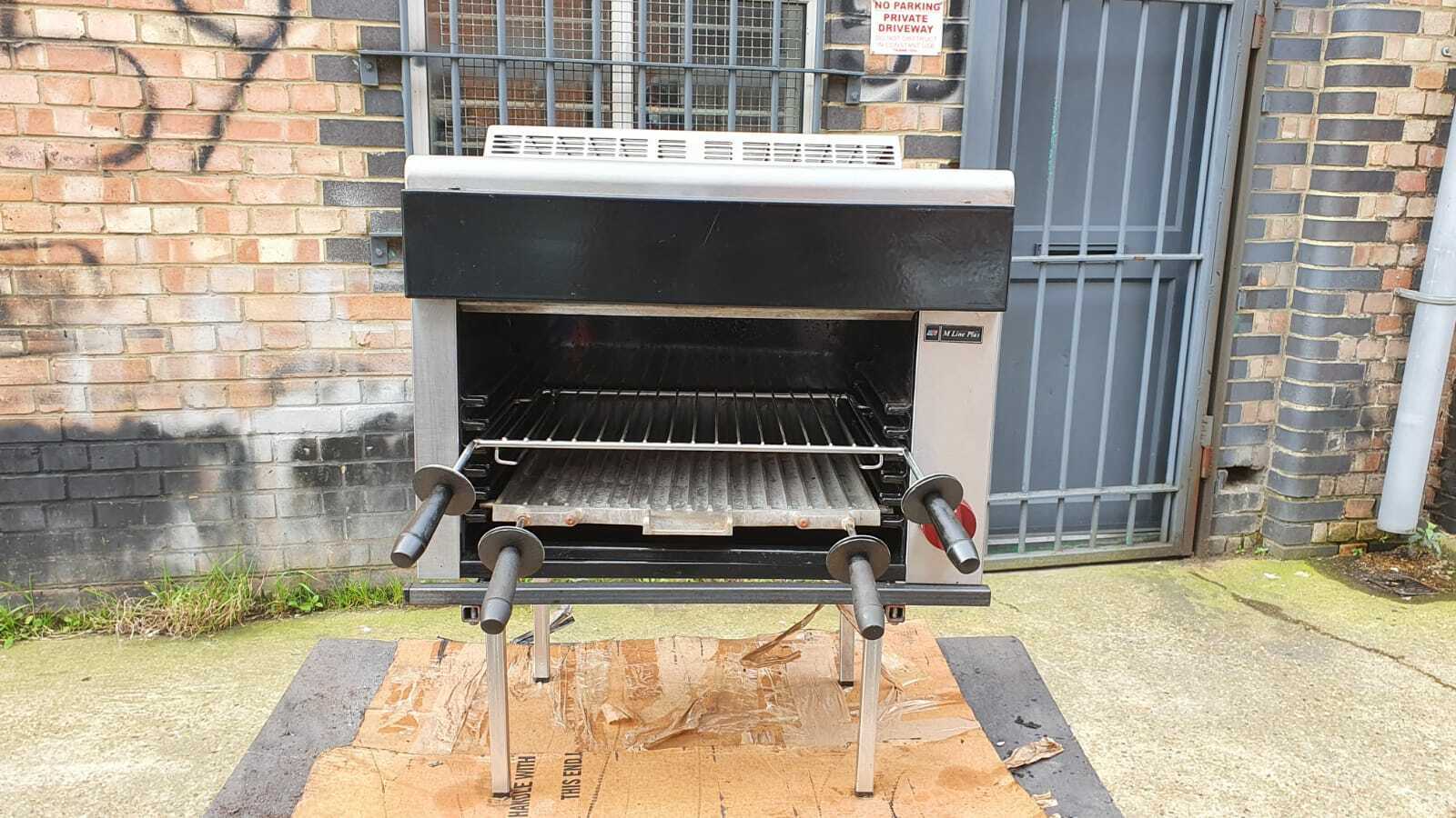 Moorwood Vulcan Natural Gas Salamander Grill 60cm with food being grilled, demonstrating its versatility for cooking steaks and sandwiches.