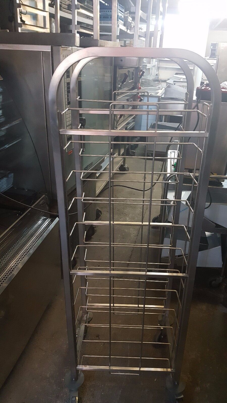 Close-up of the Stainless Steel 12 Tray Preparation Trolley Clearing Trolley on Wheels highlighting its durable stainless steel construction and smooth mobility.