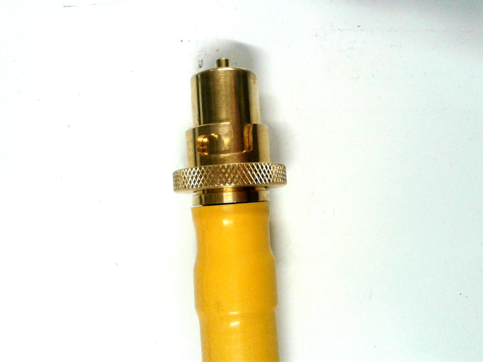 Close-up view of the 2 X Yellow Gas Pipe Commercial Catering Yellow Gas Pipe showcasing the push and twist fitting.